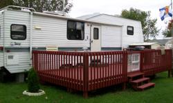 A beautifully maintained 1996 Terry Resort 5th Wheel 32ft comes complete with deck and shed.This trailer is located at Camp Barcovan situated 15kms south of the 401 between the towns of Brighton and Trenton, (Quinte west) close to the beautiful beaches of
