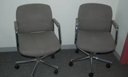 THREE OFFICE DESK CHAIRS
 
Two matching manager dark grey desk swivel chairs and one high back light grey tweed manager swivel desk chair.  All are height and tilt adjustable.  $50.00 each.  Available immediately.  3 grey desks also available in separate