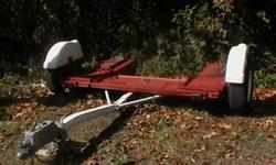 The tow dolly is in good shape comes with two tie down straps and a spare tire,it has heavy duty tires and the lights work.it comes with brake-away hydraulic brakes .it was made in 2007 . The dolly was made in Peterborough On. I have the sale papers,it