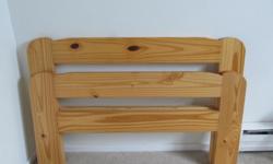 The headboard & foot board are made of solid oak
