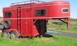 Two horse trailer, 6'9" tall inside, rear loading ramp.
 
Asking 2200 obo