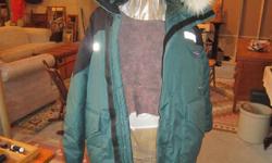 This is the best winter jacket you will find. It is made in Churchill, Manitoba where I purchased it a few years back. Exterior is nylon and cotton with a 70% duvet and 30% feather lining. It has the tunnel hood lined with a stripe of fox fur around the