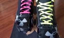 UA cleats Size 8.5 with ankle protection. Bought new for $55.00 and worn for 3 months and no longer fit. Still in great condition and clean. You have a choice btw pink or yellow laces. Great for football or baseball.