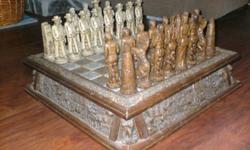 We bought this unique hand carved chess set 25 years ago at an Indian reservation in Arizona on a road trip to Vegas. The board measures about 21? x 21? and is about 5? high. It includes 2 drawers where the chess pieces are kept when not being displayed.