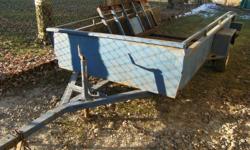 Utility trailer. Selling as is.  Good project for the winter.  6 x 10 ft.  Needs to have new boards and steel supports welded back on bottom of box.  Asking $200.00  Please call Anne at 905-715-6070