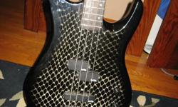 Vantage 4 string Bass guitar with snake skin finish. plays great. 150 or best offer.thanks