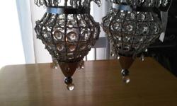 Gorgeous Glass (looks like crystal) Hanging Chandeliers with Nice Beaded Detail. 
 
Brand new. Still has tags. Smoke free home.
 
Hang anywhere you want to add some sparkle and up the 'wow' factor.
hang above each nightstand
for a spa like bath
on the