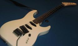 Great late 80's Japanese-made Kramer Focus 6000 in white with rare matching headstock, silver hardware, slanted humbucker and 2 single coils with individual switches and Floyd Rose locking tremolo for those monster dive-bombs.
More info here:
