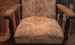 Beautiful old solid wood arm chair. Has been recovered in quality fabric.