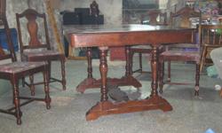 ANTIQUE TABLE WITH WOODEN CASTER WHEELS PIANO DRAW STRING  FLIP UP LEAF. VERY UNIQUE FOUR MATCHING CHAIRS
NEEDS SOME LOVE AND A GOOD HOME
$240.00 OR MAKE AN OFFER
VIEW OTHER ADS