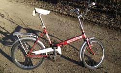 Vintage Red Folding Bicycle
Made in Austria
Maintained by a professional bike mechanic. Ready to Ride.
Rear rack.