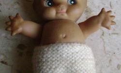 I have a Vintage Kewpie Doll with hand knit shorts that I am selling for $40. This doll has moveable arms and head only. I have included a closeup picture of the markings on the back. It was made by ZIMS in Hong Kong. Email or give me a call, ask for