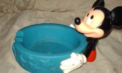 This is an adorable Mickey Mouse Pet Dish Holder.  You can turn Mickey's head side to side.  It is a vintage item in excellent condition.  Trade marking on bottom says "The Walt Disney Company Applause" TM, Made in China.
 
Great Collectible.
 
Located
