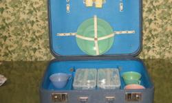 FOR SALE - VINTAGE PICNIC SET - INCLUDES STURDY BLUE VINYL FINISH CASE (looks like a suitcase) WITH ORIGINAL SALT/PEPPER, PLATES (4), CUPS (4), SAUCERS (4), AND 2 PLASTIC FOOD CONTAINERS.  ALL ARE IN EXCELLENT CONDITION, THE CASE MEASURES 19" WIDE  x  15"