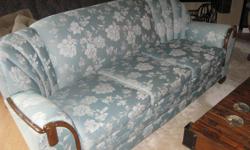 Beautiful vintage sofa. The fabric is a very pretty light green and is in excellent condition. The wood is also in excellent condition. The sofa measures 83" across.