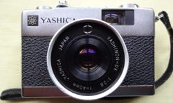 The camera is in great cosmetic and working condition Yashica cap and manual included.