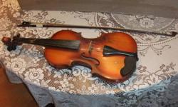 Violin, Bow and Case for sale. Violin is in reasonable shape; but does need some stings. Good for someone wanting to start lessons.