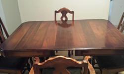 Beautiful table, 2 leafs, 6 chairs - one with arms. Horse hair covered seats. Black leather look. Unique wood design . I can fit 12 people at the table with both leafs in the table. Over 100 years old. I am moving and unfortunately can not take it with
