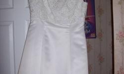 Just in time for the up coming Wedding season.Beautiful gown bought at a Boutique in Moncton.Size 16-18.Has a beautiful long train, that can be held up so not to walk on it. Has been drycleaned.All ready for that special day.The price was $1000.00 when