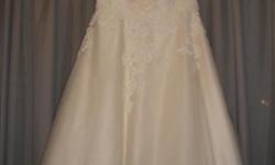 Perfect condition. Ivory in color, tea length. Beautiful lace detail