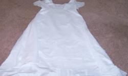 Wedding Dress & Veil
 
This beautiful size 24 wedding dress was purchased new in 2003 and had some professional alterations done to the sleeves (they used to be long). 
The train is 2-3 feet long and has a great flow to it.  The dress has beaded design in