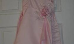 This adorable pink dress was worn once as a flower girl dress, but would be a dazzling party dress or dress up dress for a little princess. Comes with a matching shawl. Size 2. Dry cleaned. From a pet free, smoke free home. $20