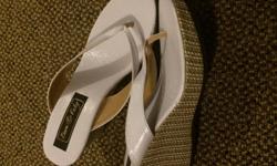 White thong wedge heels, pretty much brand new. Size 8 super cute for summer. Non smoking home. Pet free home. Great shape.