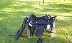 17'' western saddle black with silver trim also saddle pad bridle reins and breast strap all are new.