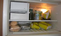 21 Cubic Feet White Whirlpool Designer style refrigerator.  Excellent working condition.