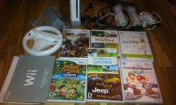 console
2 controllers
numb chucks
hi-def hook ups
steering wheel
manuals
balance board
games:
wii play
wii fit
wii sports
jeep thrills
mario kart
animal crossing - city folk
mx vs atv unleashed (still in wrapper)