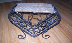 rod iron with wicker top in a heart shaped with a little ivy design in it. 17"(l) x 7"(w) x 13"(h)