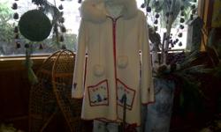 Lovely ladies white, fur trimmed hooded, wool arctic coat and made by Labrador natives. Paid $375.00, will sell for $200.00, only worn twice. Red waterproof jacket overlay also included.