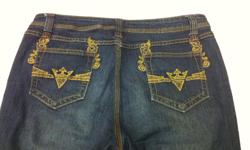 Featuring unusual crown-like matching metal button and rivet design, mid thigh "SJ" crest rivet on both sides, gold metallic stitched back pockets and distressed and crimped pattern behind knees and at top of legs in the front. Measures 41" long, 31"