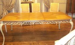 ELEGANT DINING ROOM SET WHICH COULD BE USED IN EITHER A DINING ROOM OR KITCHEN. TABLE IS WOOD AND WROUGHT IRON AND HAS A LEAF EXTENSION FOR A TOTAL OF 81 INCHES LONG.. 6 CHAIRS (INCLUDES 2 ARM CHAIRS) AND MATCHING BAKERS RACK (52 INCHES WIDE). EXCELLENT