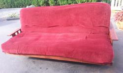 Have a wood framed futon here, no rips or tear used but good condition 100$ please text if interested