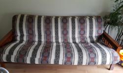 $300 OBO Wood futon with mattress. Cover can come off if you want to change it. In good condition with only a few small scratches. The length of the futon is 79 1/2 inches from edge of wood frame to other edge. The mattress is approximately 73 x 45 inches
