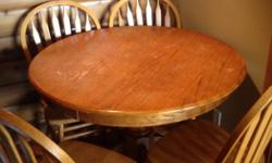 Solid wood table with 4 chairs. Table diameter is 42 inches. Some scratches. Would prefer you to pick up.
