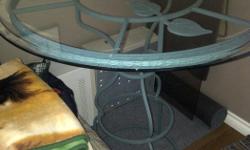 Beautiful custom made wrought iron and glass table. Bar Height. Very solid and heavy. New condition.