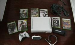 XBOX 360 in perfect condition with games and accessories.