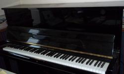 Young Chang Piano for sale Black Laquer comes with Piano bench. Piano measures 59 inches in  length 49 inches high..