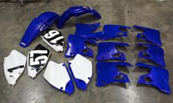 I have a box of take-off plastics from a 2001 YZ250, fits 1996 to 2001 125 and 250. Full set for $75, shrouds $30 pair, left side number plates $15 ea, or take the whole works for $125.