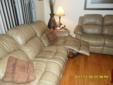 1 leather couche and 1 leather love seat