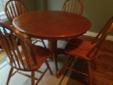 wooden table and four chairs